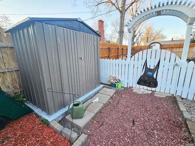 view of shed with a fenced backyard
