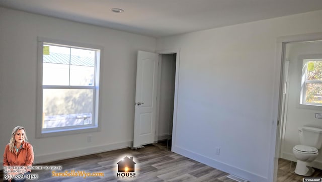 unfurnished bedroom with baseboards and wood finished floors