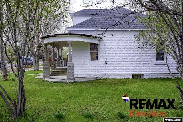 602 S 6th St, Basin, WY 82410 - view of home's exterior with a lawn and a shingled roof