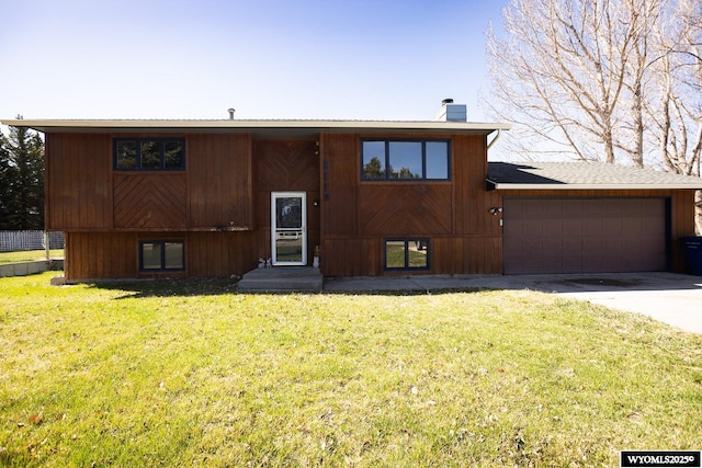 bi-level home featuring a front yard and a chimney