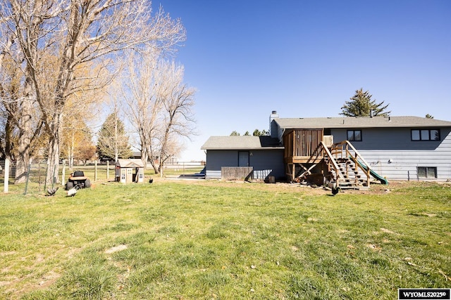 view of yard with stairs and a wooden deck