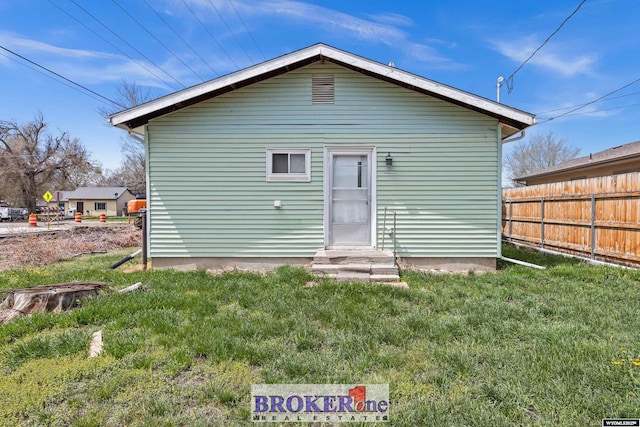 1105 N Elma, Casper, WY 82601 - back of house with fence, a yard, and entry steps