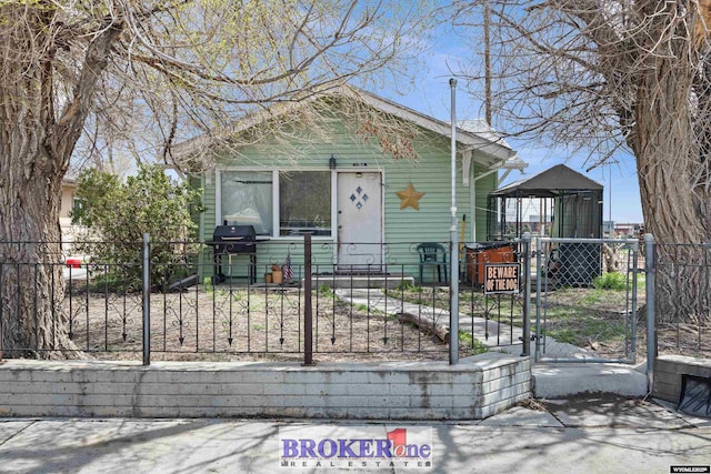 1105 N Elma, Casper, WY 82601 - view of front facade featuring a gate and a fenced front yard