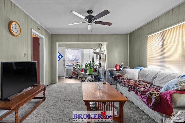 1105 N Elma, Casper, WY 82601 - carpeted living room featuring wooden walls, plenty of natural light, ceiling fan, and crown molding