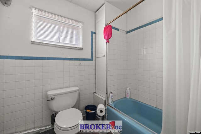 1105 N Elma, Casper, WY 82601 - full bathroom featuring shower / bathtub combination with curtain, a wainscoted wall, toilet, and tile walls