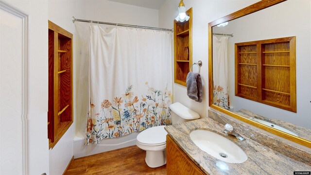 94 Grandview Ln, Riverton, WY 82501 - full bath with vanity, shower / tub combo with curtain, wood finished floors, and toilet