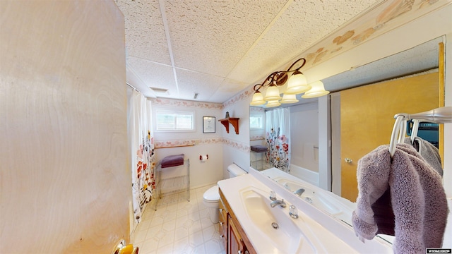 94 Grandview Ln, Riverton, WY 82501 - bathroom featuring toilet, a drop ceiling, curtained shower, and vanity