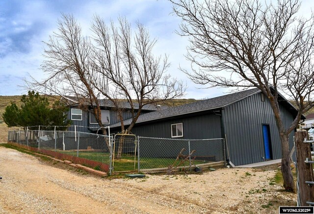 5421 S Okeepa, Casper, WY 82604 - exterior space featuring fence, a gate, a shingled roof, and driveway