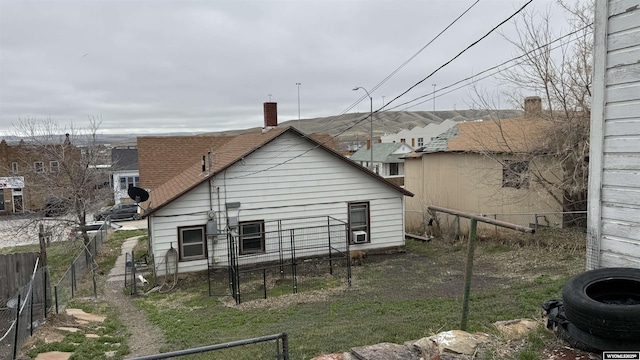 back of property featuring fence