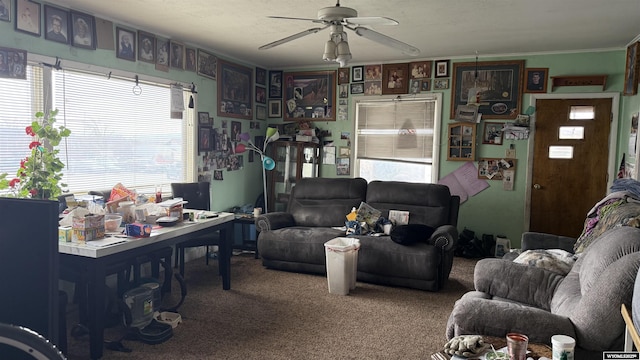 carpeted living room with ceiling fan