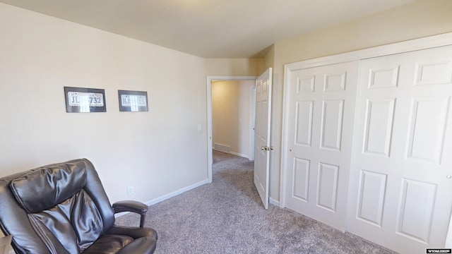 living area featuring baseboards, carpet, and visible vents