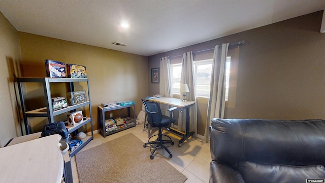 tiled home office featuring visible vents