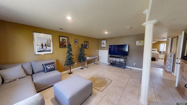 living room featuring recessed lighting, ornate columns, light tile patterned flooring, and visible vents