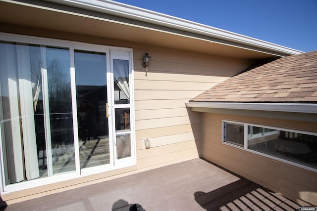 view of side of home featuring a shingled roof
