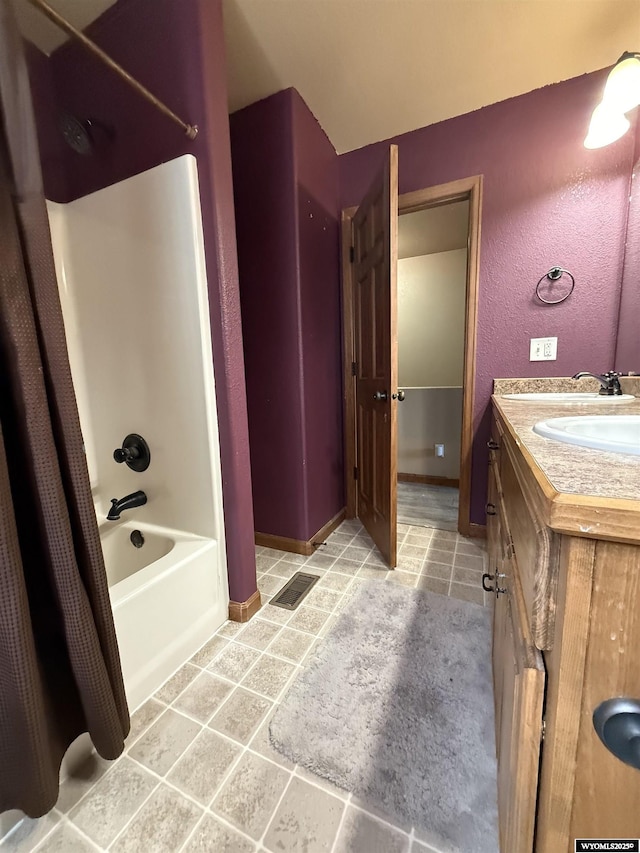 full bath with vanity, visible vents, tile patterned floors, baseboards, and shower / bathtub combination with curtain