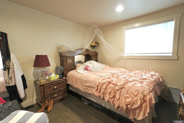 bedroom with dark wood-type flooring and recessed lighting