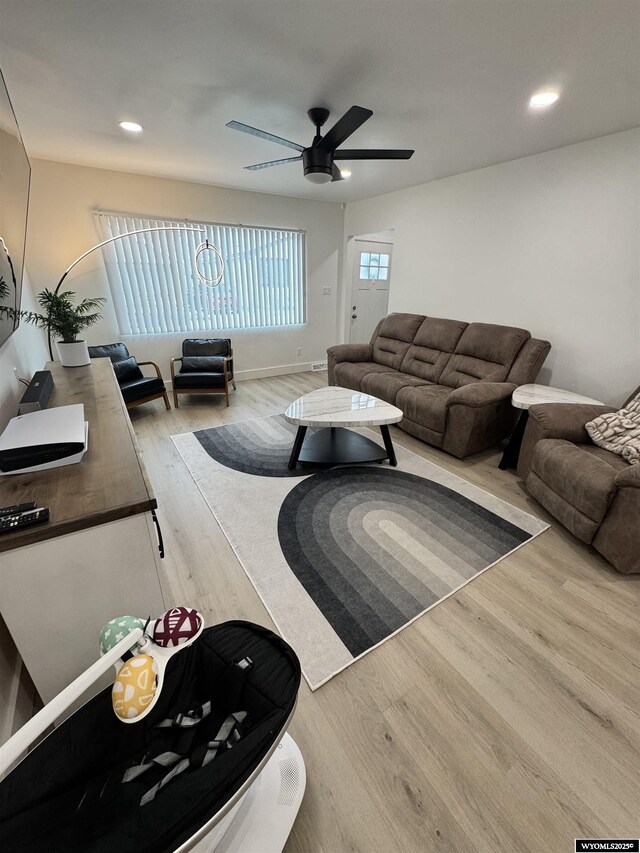 822 W St, Rock Springs, WY 82901 - living area featuring wood finished floors, a ceiling fan, and recessed lighting