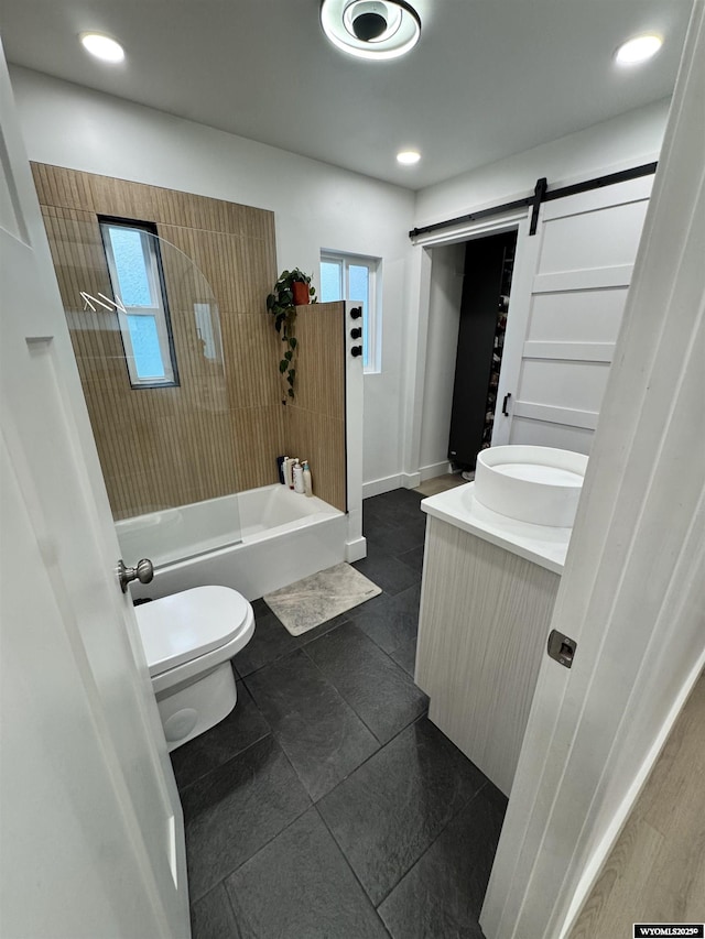 822 W St, Rock Springs, WY 82901 - bathroom featuring vanity, toilet, baseboards, tile patterned flooring, and shower / washtub combination