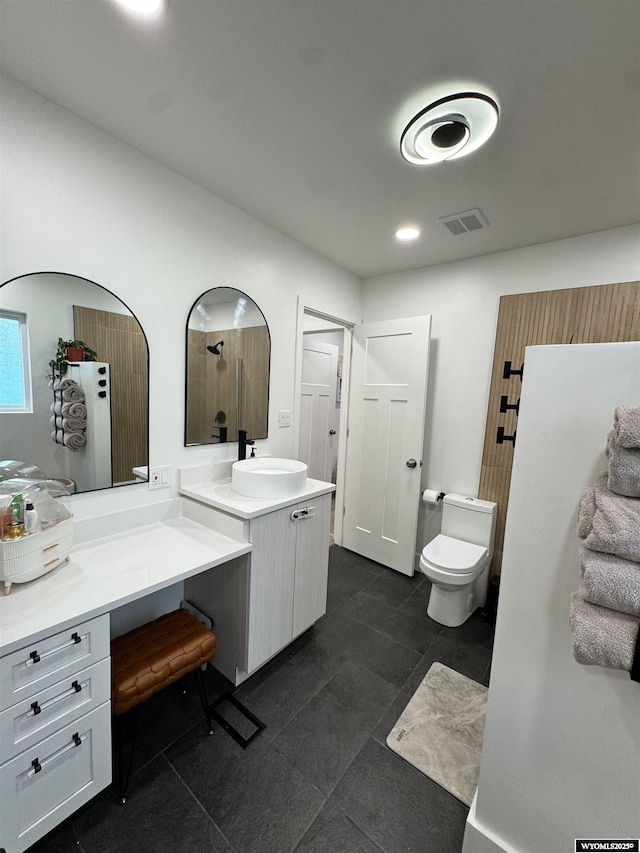 822 W St, Rock Springs, WY 82901 - bathroom featuring toilet, vanity, tile patterned floors, and recessed lighting