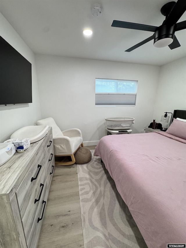 822 W St, Rock Springs, WY 82901 - bedroom with light wood-type flooring, a ceiling fan, baseboards, and recessed lighting