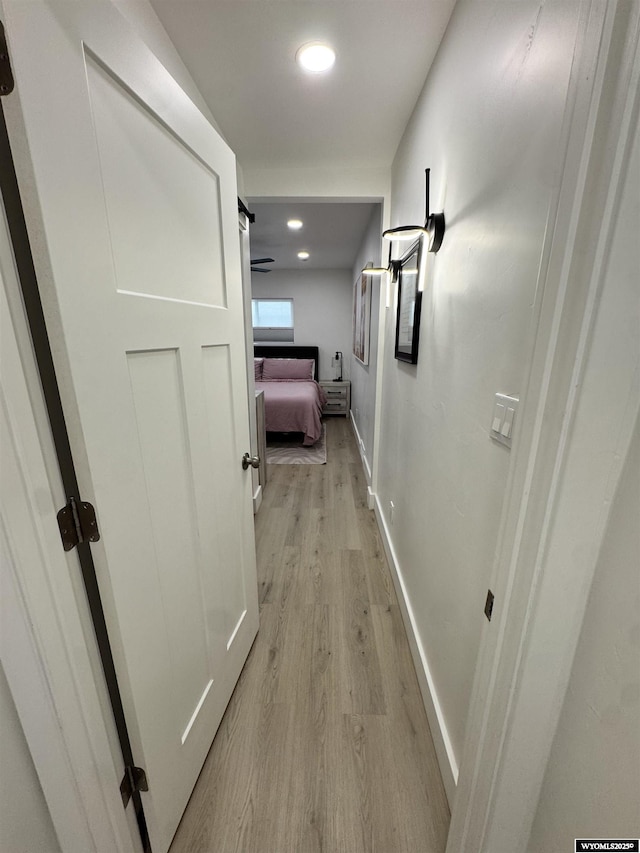 822 W St, Rock Springs, WY 82901 - corridor with light wood-type flooring, baseboards, and recessed lighting
