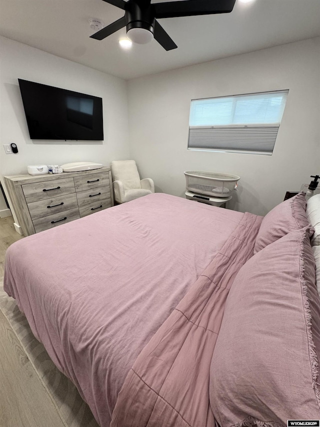 822 W St, Rock Springs, WY 82901 - bedroom with wood finished floors and a ceiling fan
