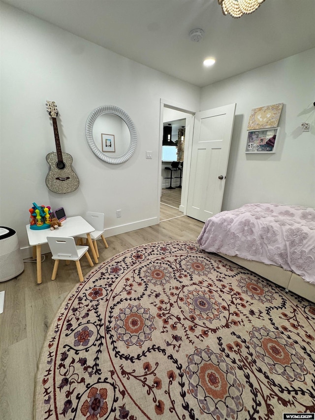 822 W St, Rock Springs, WY 82901 - bedroom featuring wood finished floors, baseboards, and recessed lighting
