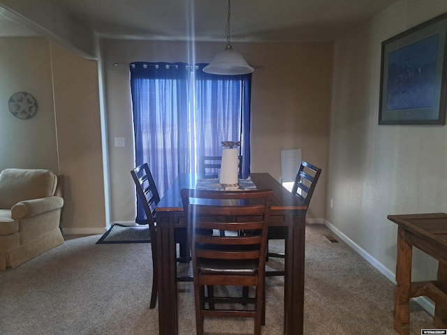 70B 27th St, Wheatland, WY 82201 - dining space featuring carpet flooring and baseboards