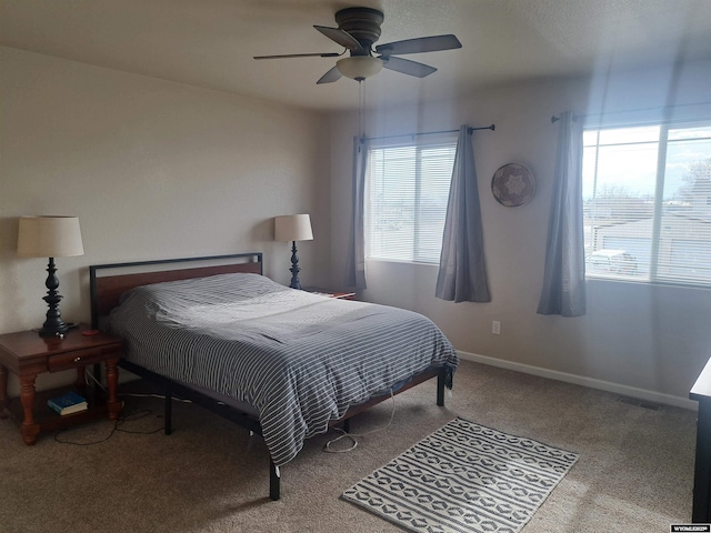 70B 27th St, Wheatland, WY 82201 - bedroom with a ceiling fan, carpet flooring, visible vents, and baseboards