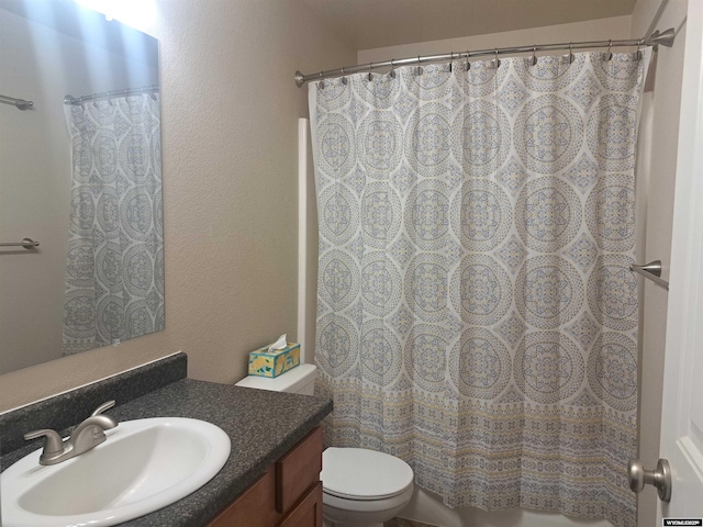 70B 27th St, Wheatland, WY 82201 - full bath featuring vanity, toilet, a shower with shower curtain, and a textured wall