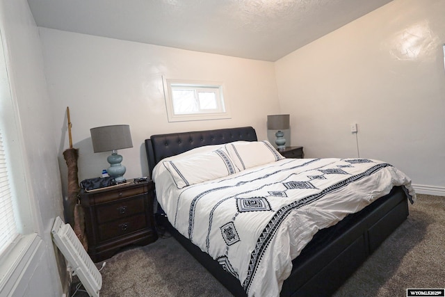 bedroom featuring baseboards and carpet floors
