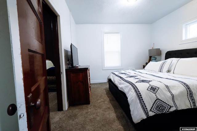 bedroom with carpet flooring and baseboards