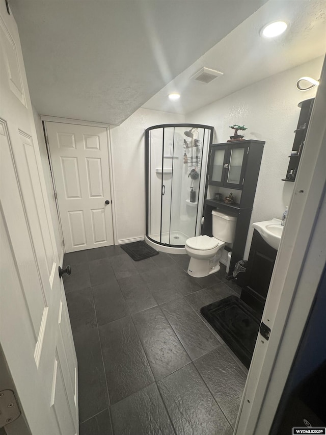 117 Sandstone Dr, Evanston, WY 82930 - full bath featuring a shower stall, recessed lighting, vanity, and toilet