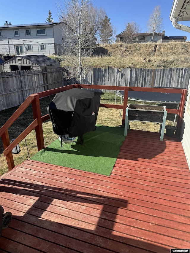 117 Sandstone Dr, Evanston, WY 82930 - wooden terrace featuring area for grilling and a fenced backyard