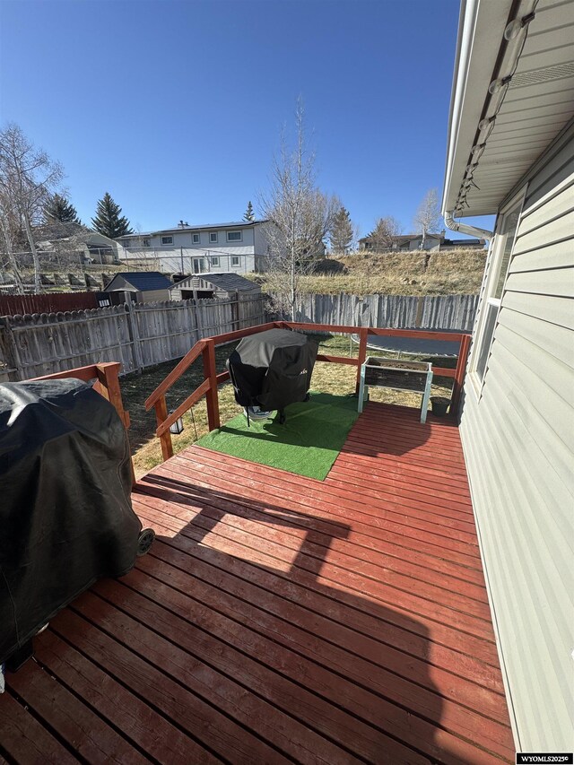 117 Sandstone Dr, Evanston, WY 82930 - wooden deck featuring a fenced backyard and a water view