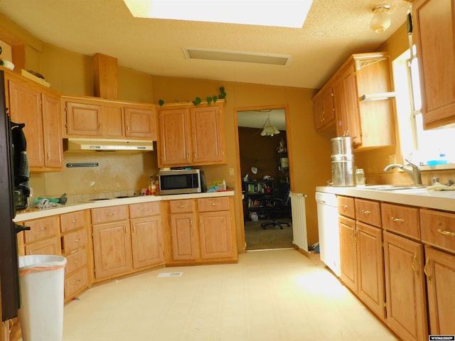 479 Hoskins Ln, Rock Springs, WY 82901 - kitchen with a sink, white appliances, under cabinet range hood, light countertops, and lofted ceiling