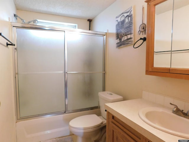 479 Hoskins Ln, Rock Springs, WY 82901 - bathroom with toilet, enclosed tub / shower combo, and vanity