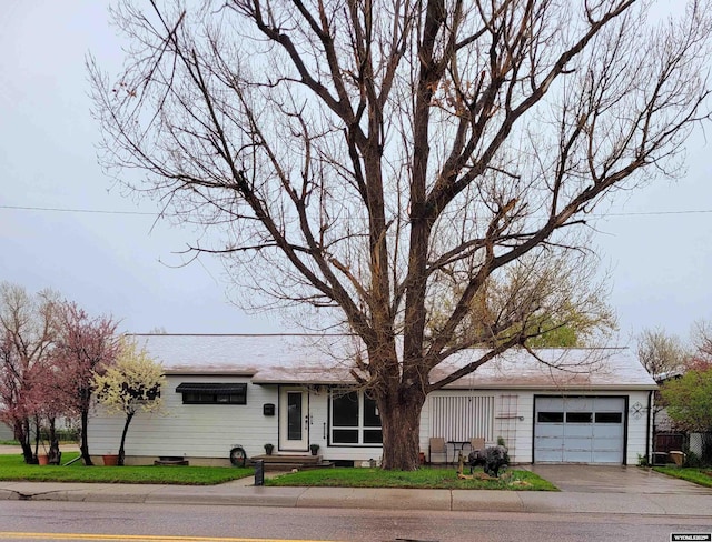 1001 Country Club Rd, Casper, WY 82609 - view of front of house featuring a garage and concrete driveway