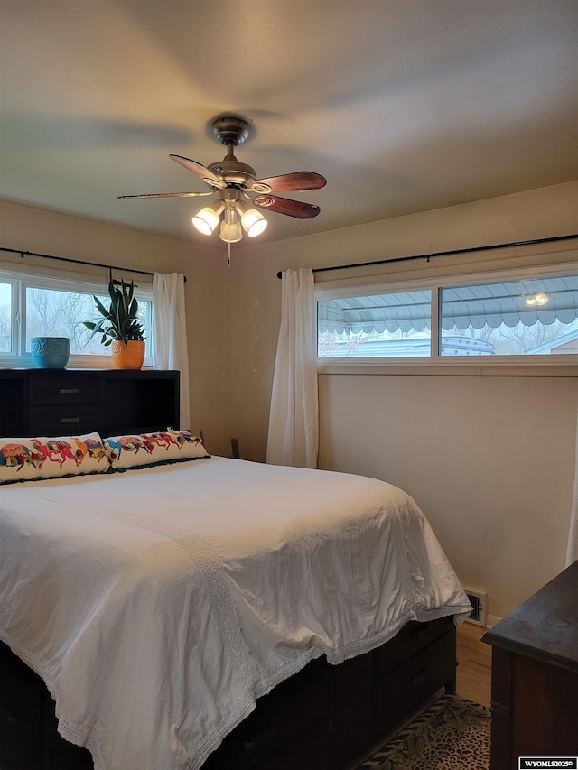 1001 Country Club Rd, Casper, WY 82609 - bedroom with ceiling fan and wood finished floors