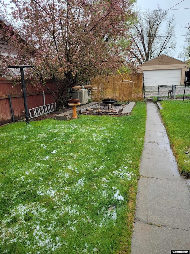1001 Country Club Rd, Casper, WY 82609 - view of yard with a fire pit and a garage