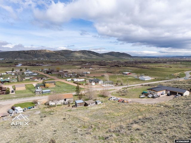 birds eye view of property with a rural view and a mountain view