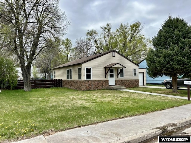 view of front facade with brick siding and driveway