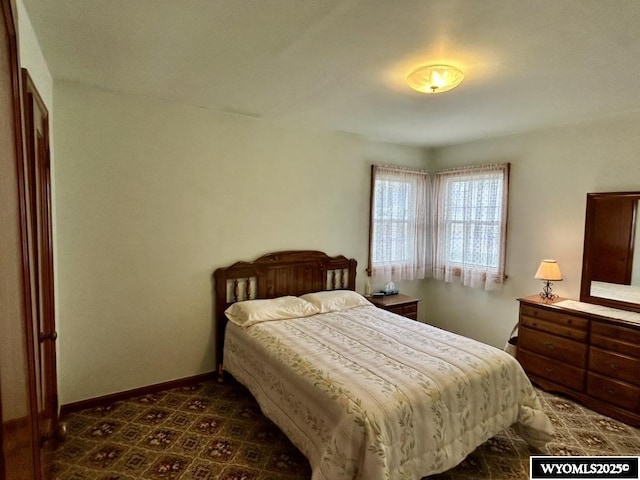 bedroom featuring baseboards