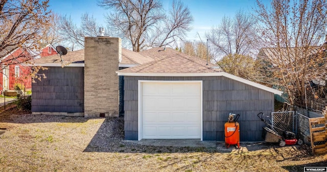 garage with fence