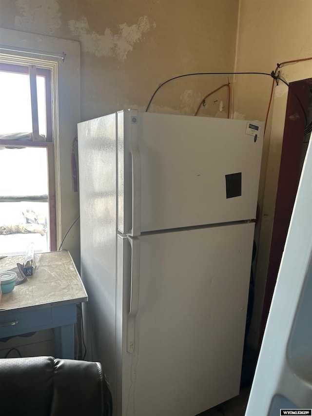 31 1st St, Rock Springs, WY 82901 - kitchen featuring freestanding refrigerator, tile countertops, and refrigerator