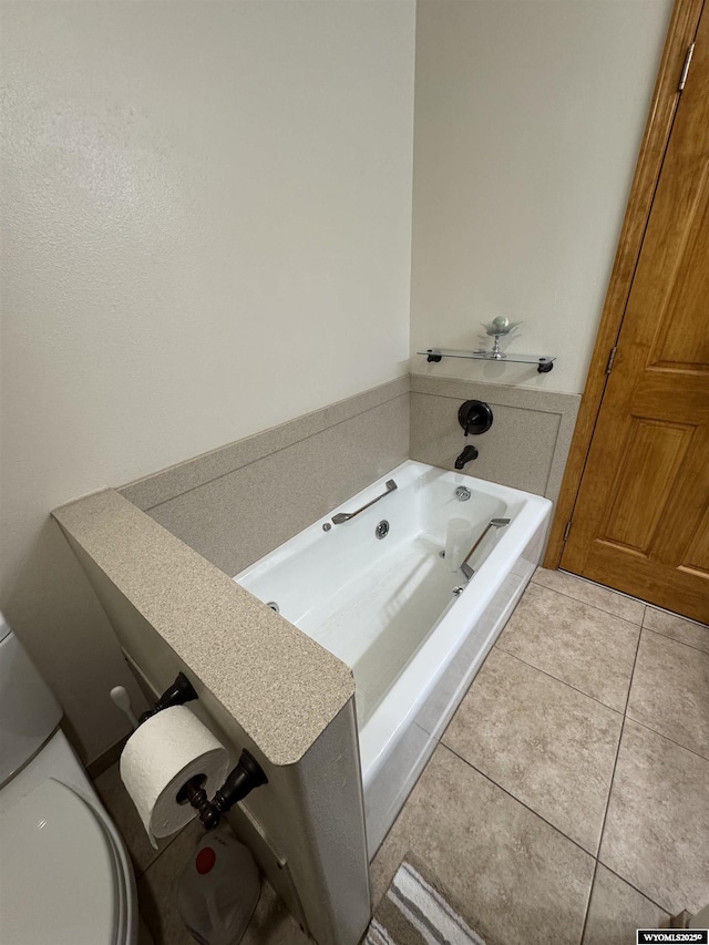 191 Lester Dr, Rock Springs, WY 82901 - bathroom with a garden tub, toilet, and tile patterned flooring