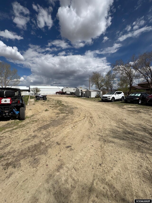 191 Lester Dr, Rock Springs, WY 82901 - view of vehicle parking featuring a water view