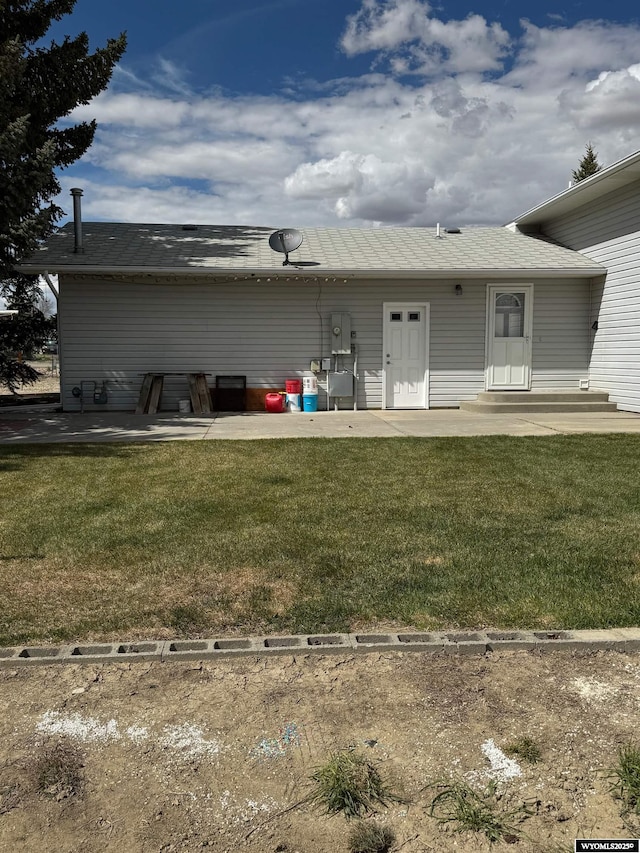 191 Lester Dr, Rock Springs, WY 82901 - back of house with a yard and a patio