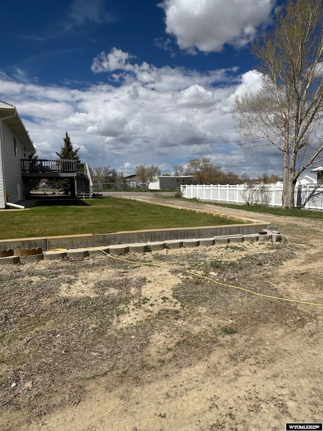 191 Lester Dr, Rock Springs, WY 82901 - view of yard with fence, a deck, and stairs