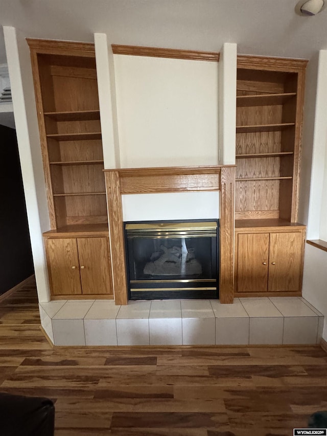 191 Lester Dr, Rock Springs, WY 82901 - detailed view of wood finished floors and a glass covered fireplace